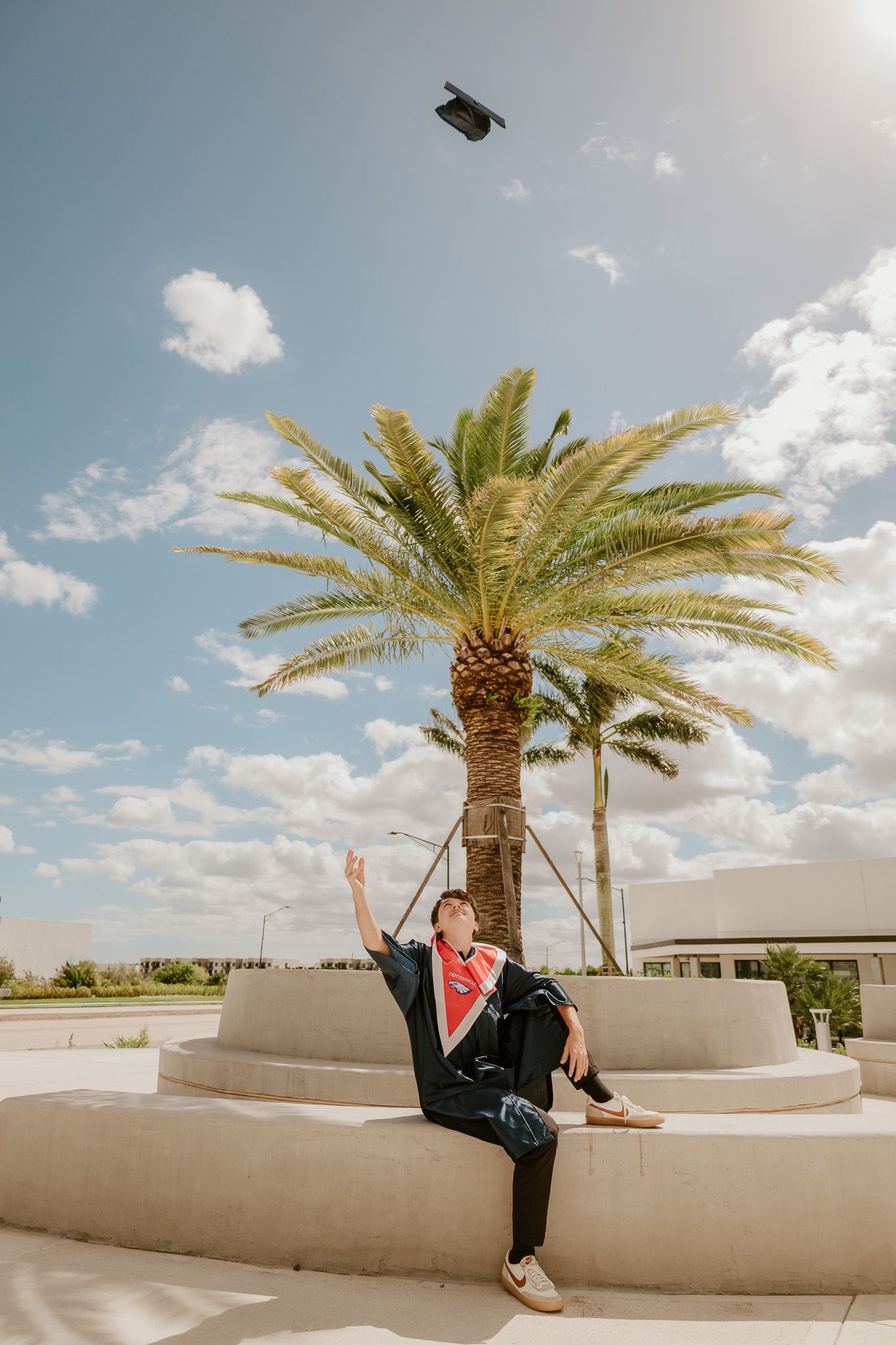 A series of photos showing someone lounging on a white stucco wall with palm trees and blue sky in the background.