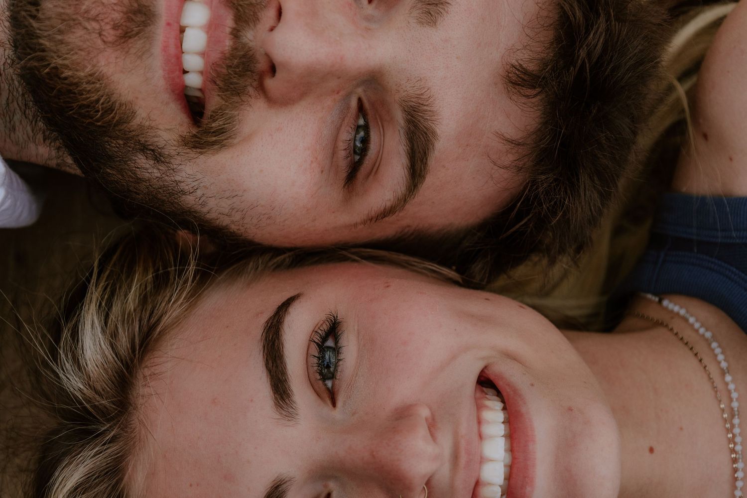 A collage of six close-up photos showing smiling expressions and joyful moments.
