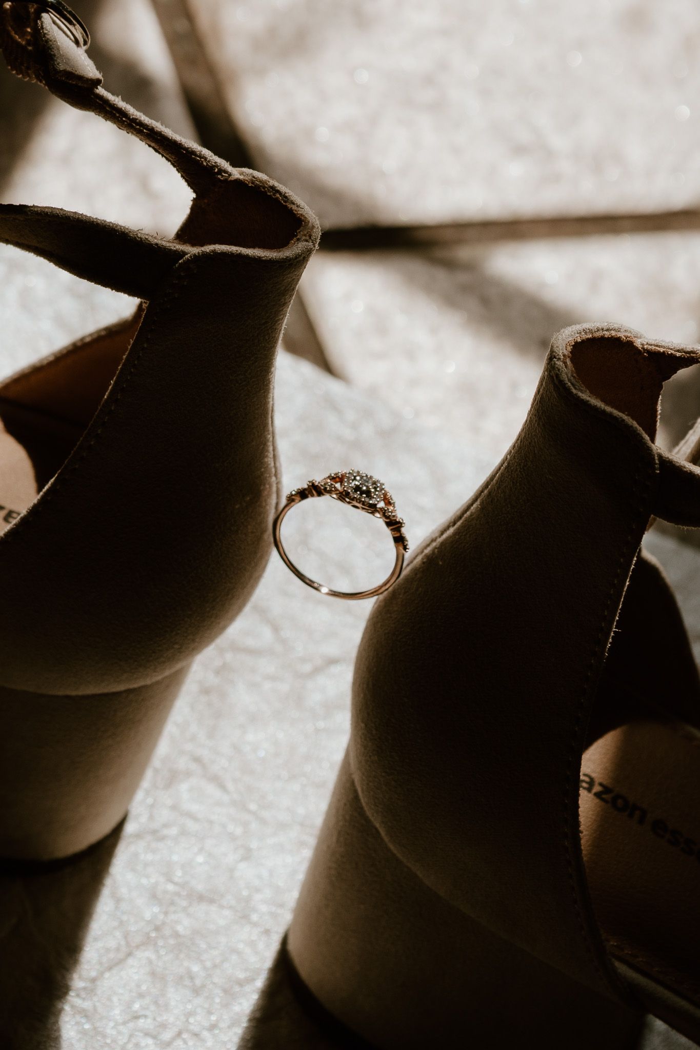 Artistic sepia toned macro photograph showing silhouettes of ceramic pottery or vases in a row.