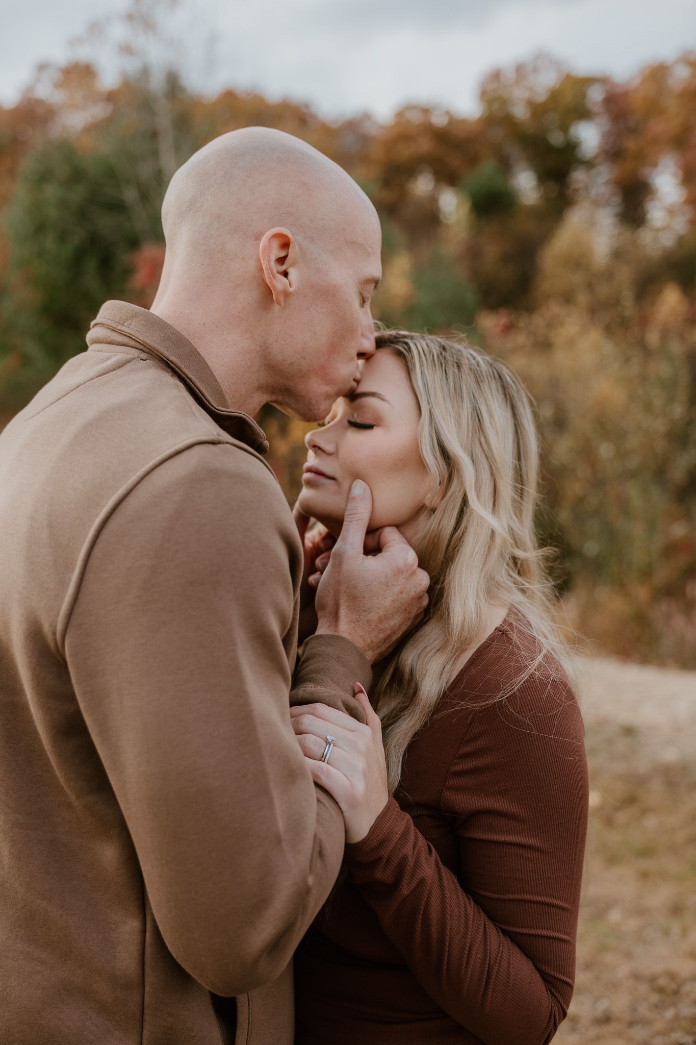 A romantic autumn photo sequence showing a couple sharing tender moments in warm brown tones.