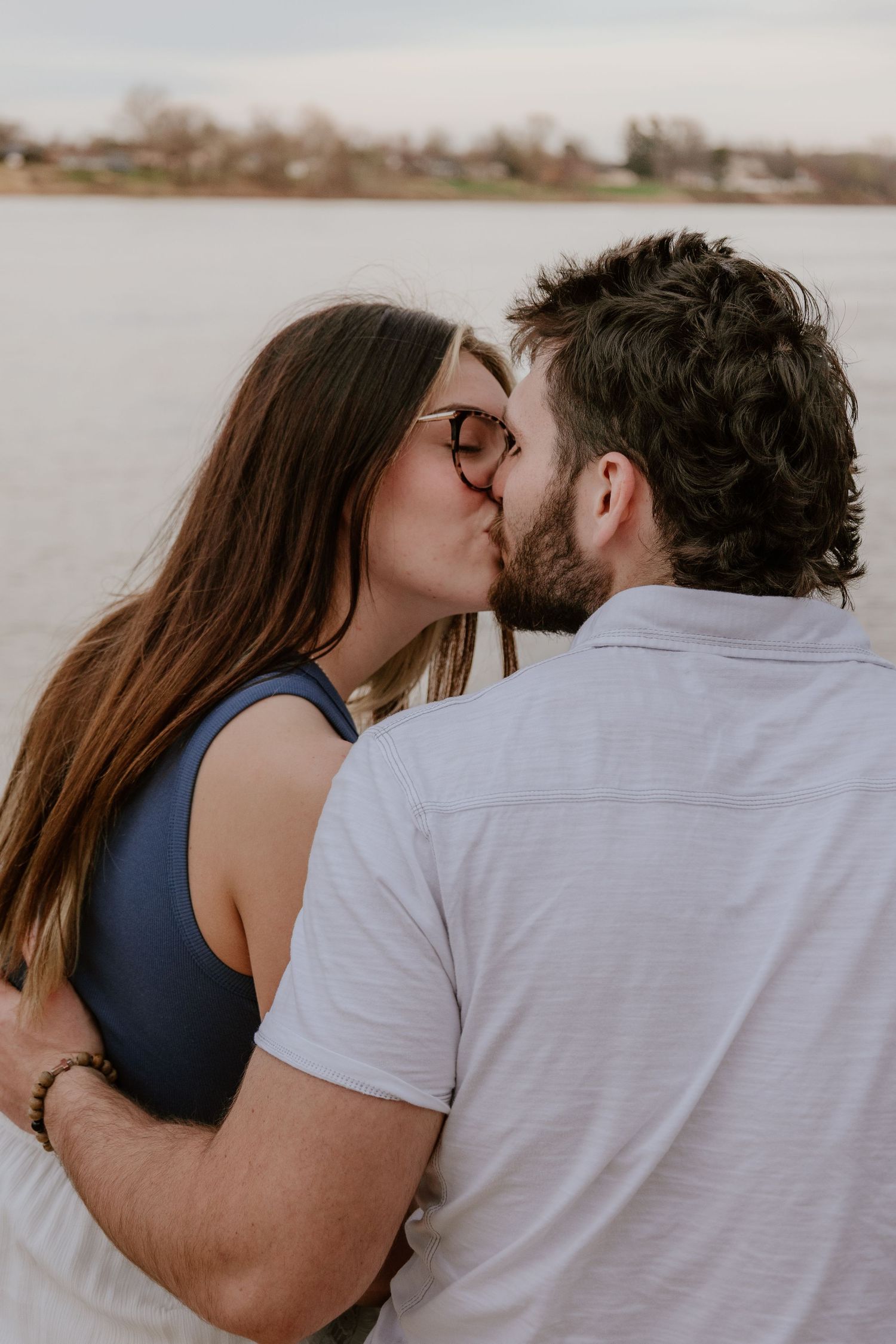 A romantic couple shares an intimate moment in a series of tender black and white photographs.
