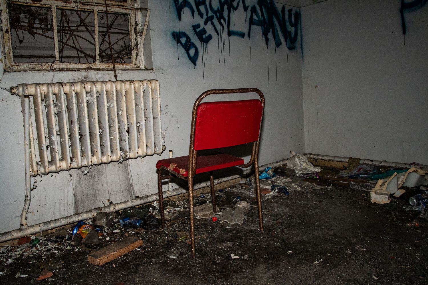 chair left beind in the maternity wing of an abandoned hospital. unsettling. amman valley maternity hospital