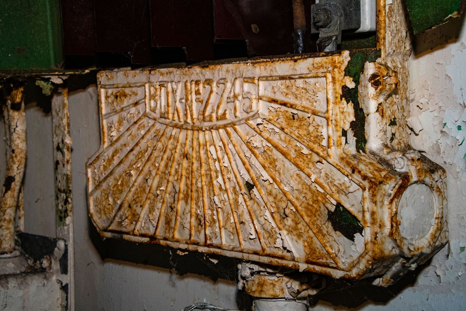 Heavily rusted industrial machine part  photographed inside a derelict hospital. amman valley maternity hospital ash olion photography.