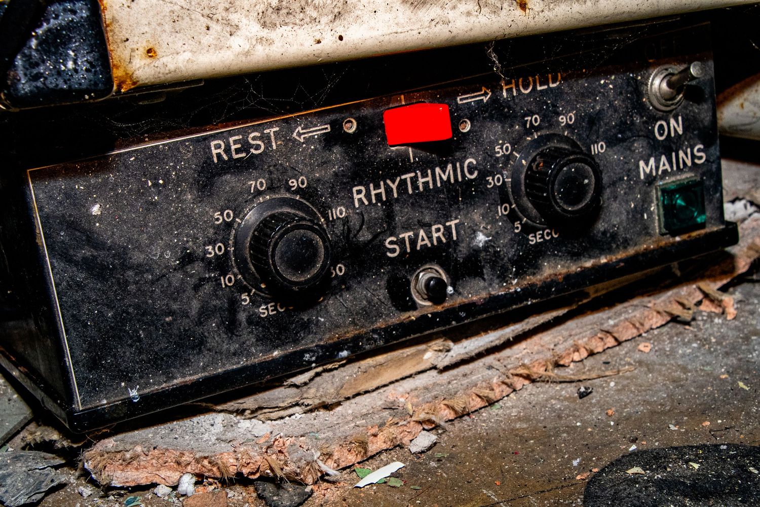 Decayed control panel with corroded buttons and labels inside a derelict hospital. amman valley maternity hospital ash olion photography.