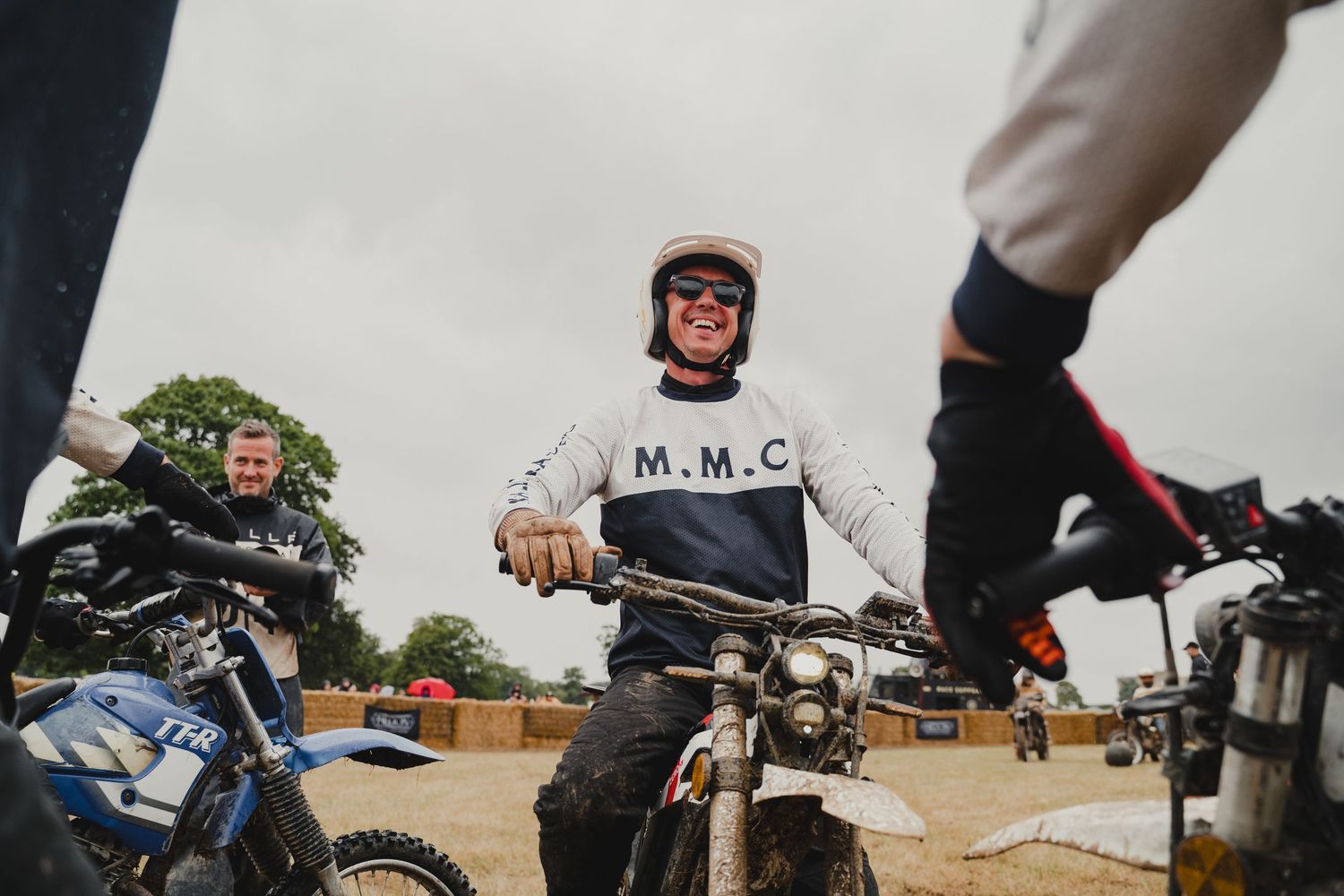 Close-up shots of muddy motorcycle handlebars and riders during an off-road event.