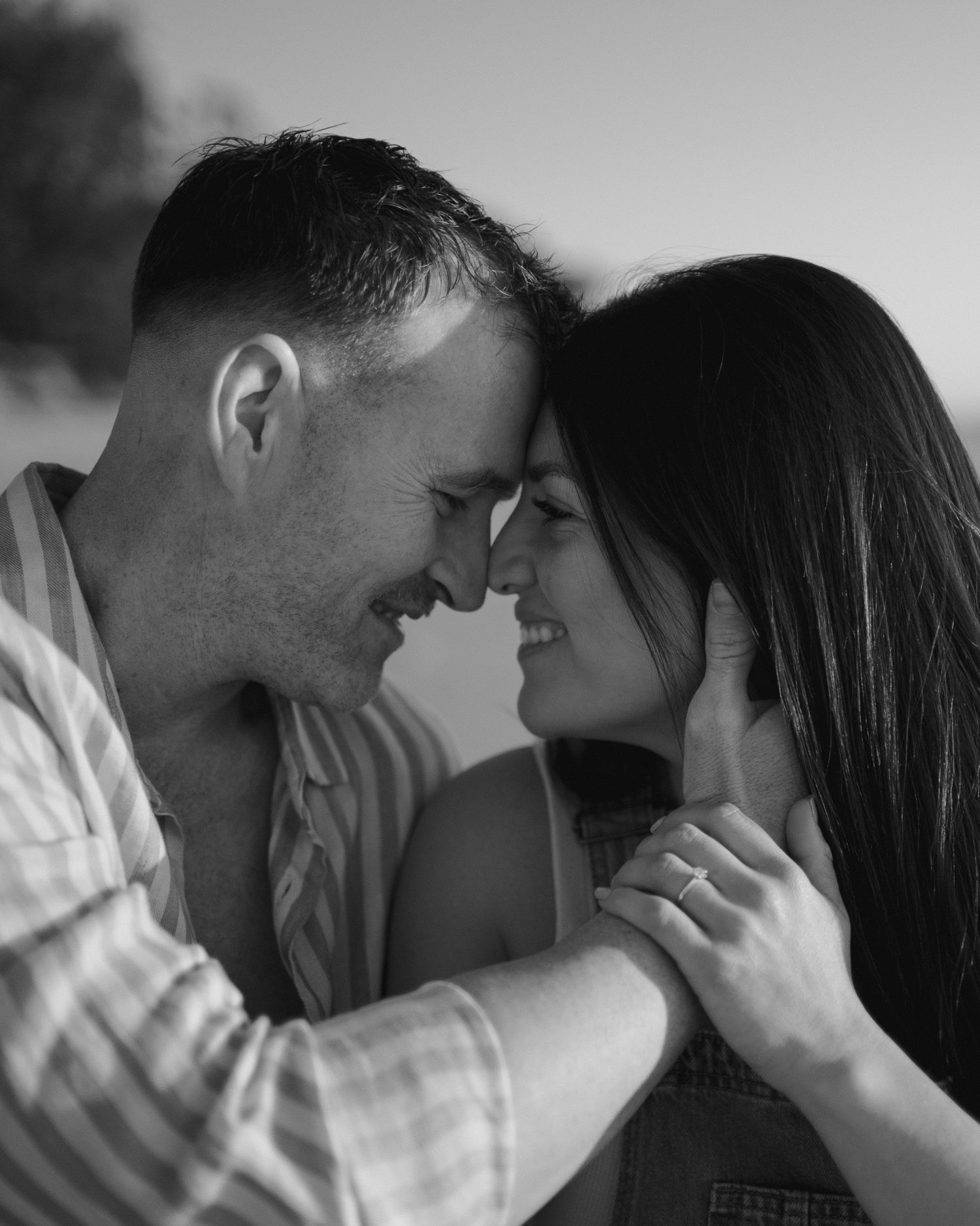 Black and white close-up shots of a couple sharing intimate moments.