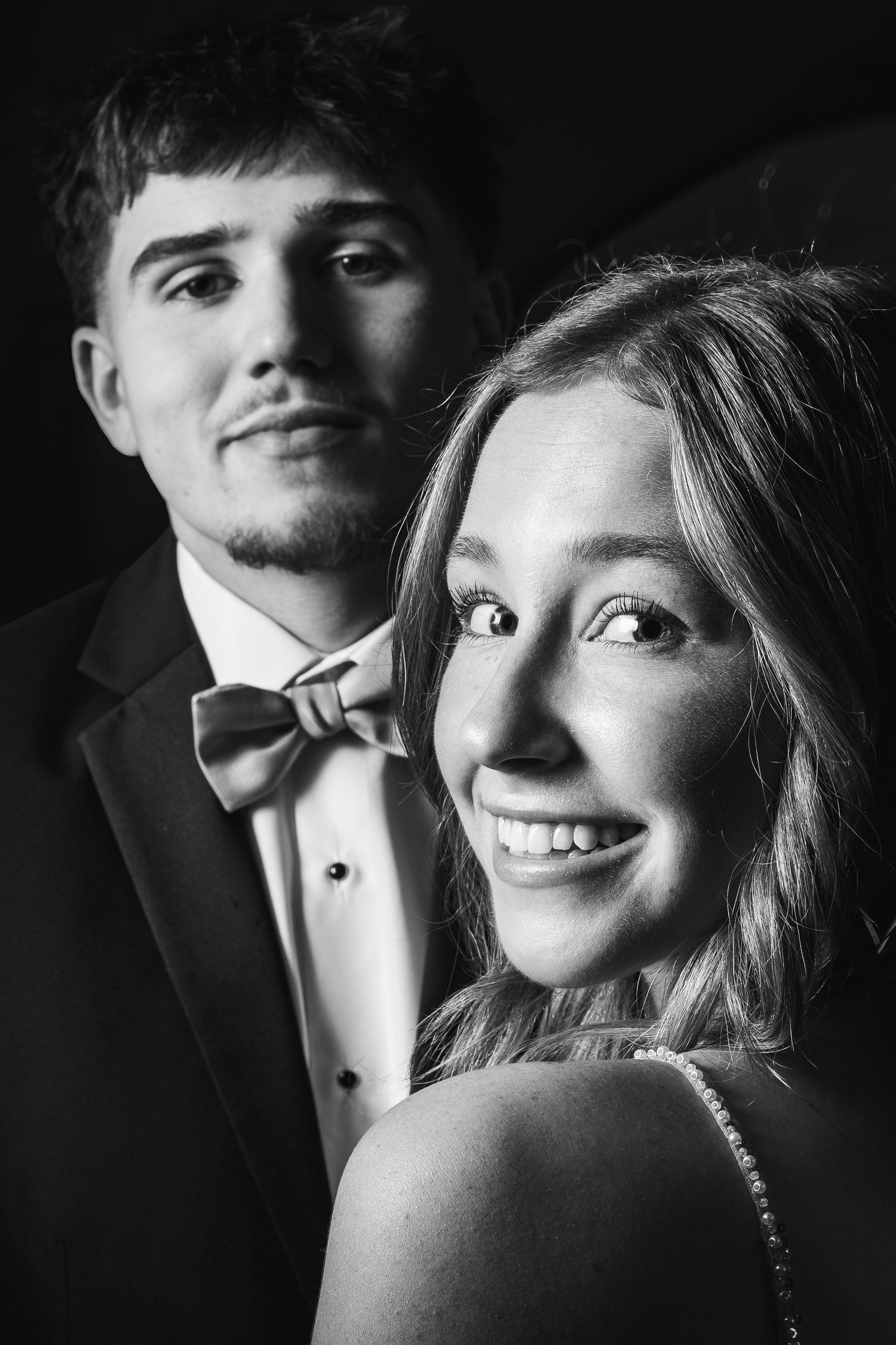 Elegant black and white formal portrait series with romantic lighting.