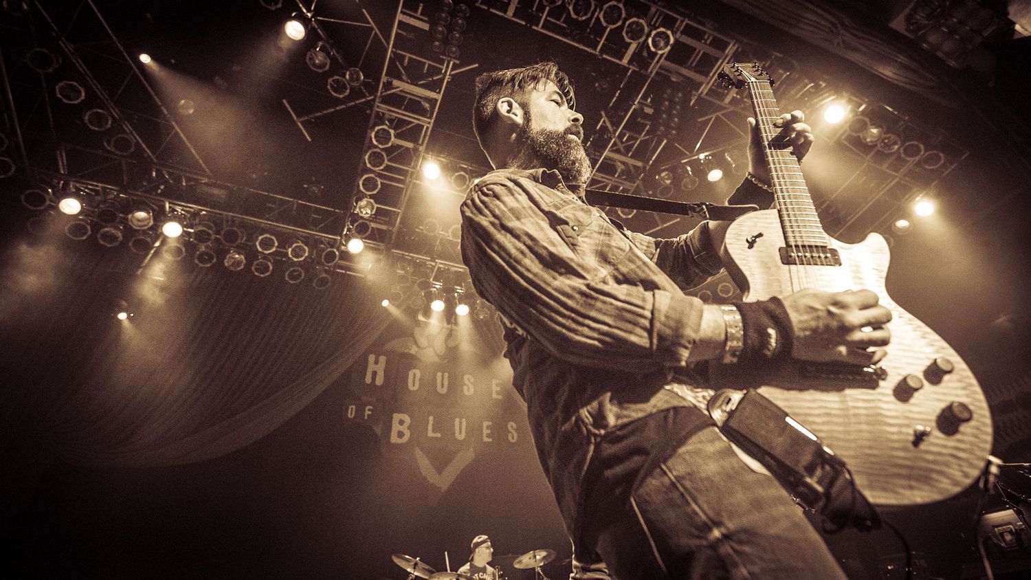 Concert stage photography sequence showing dramatic lighting and performance angles.