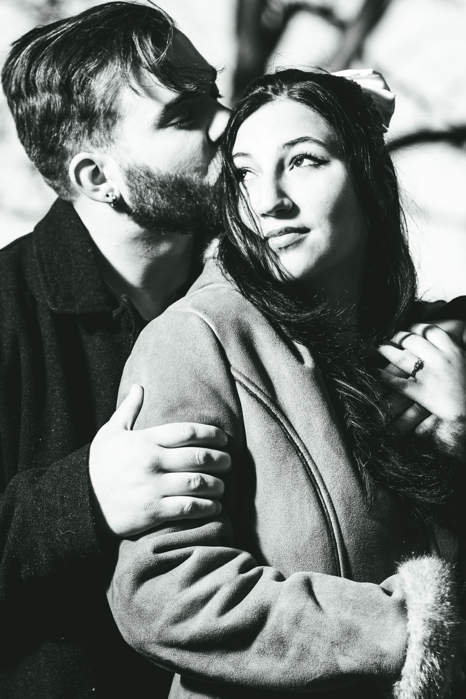 A series of intimate black and white romantic portraits showing tender embraces and emotional moments.