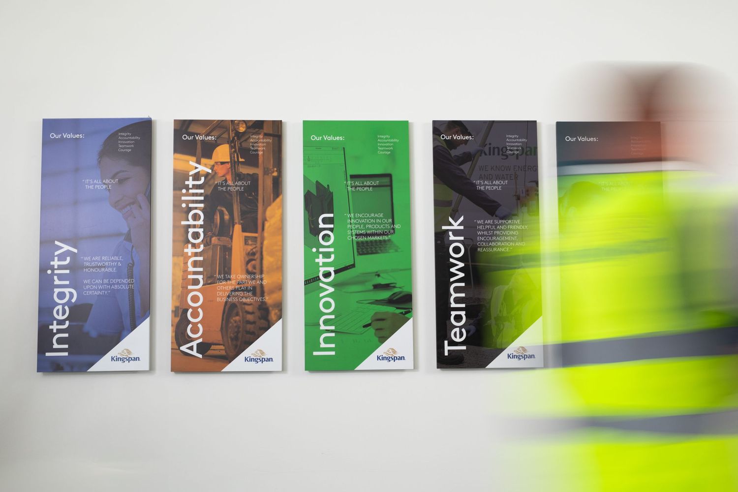 Kingspan core values wall display showing Integrity, Accountability, Innovation, and Teamwork posters. Kingspan Water & Energy