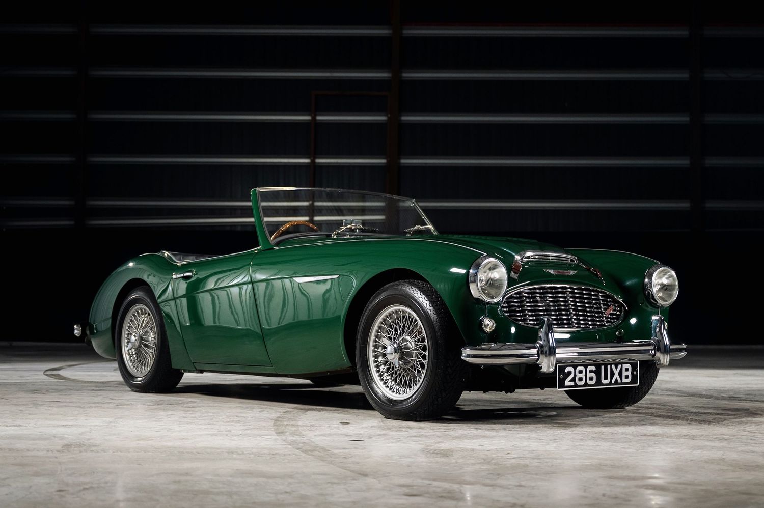 British racing green Austin-Healey 100 classic sports car with wire wheels. Motorist Collection