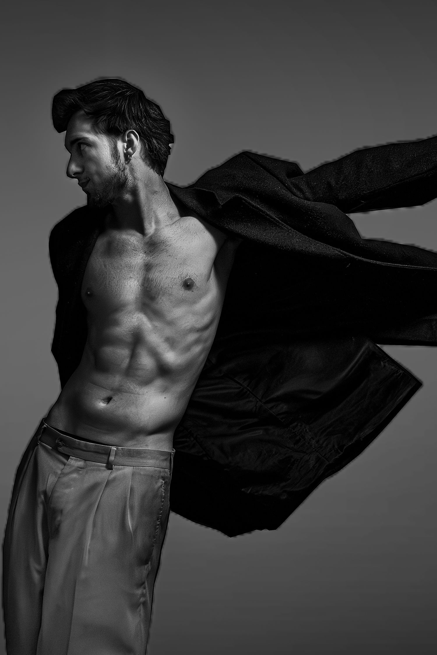 Male model throwing jacket