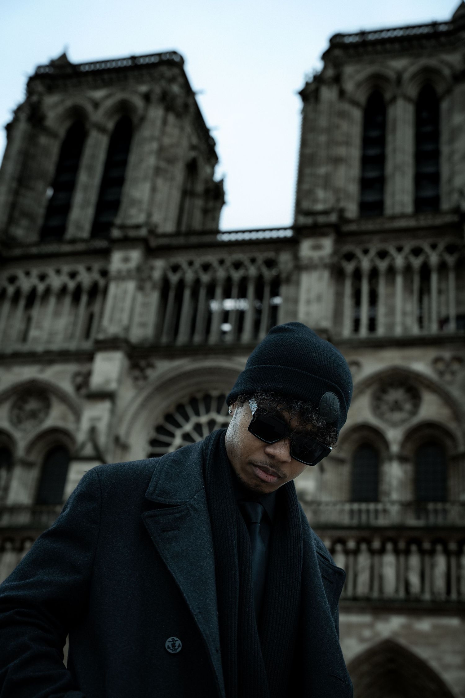 Man standing in front of Notre Dame