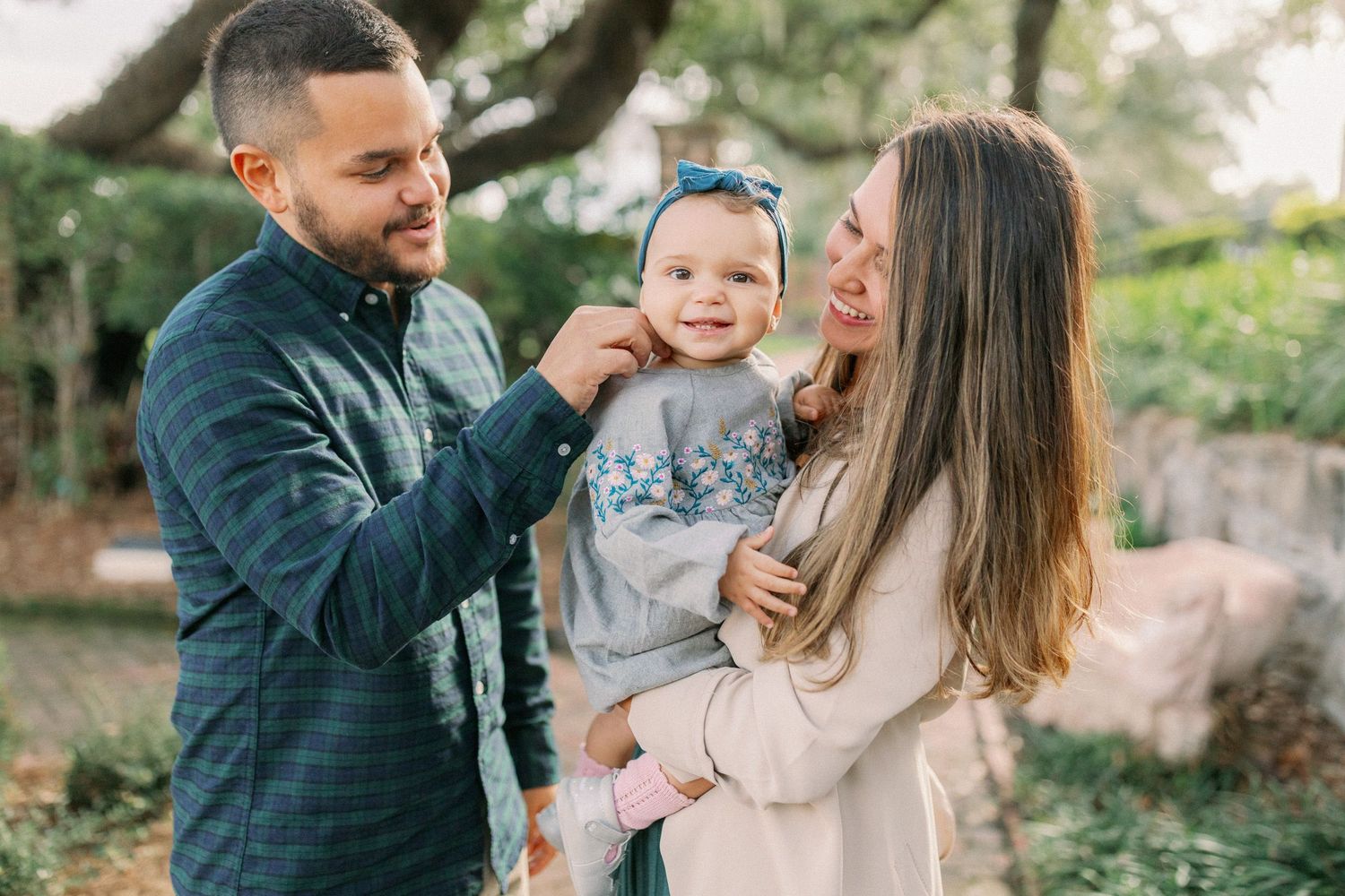 A series of candid family photos showing tender moments and laughter in an outdoor setting.