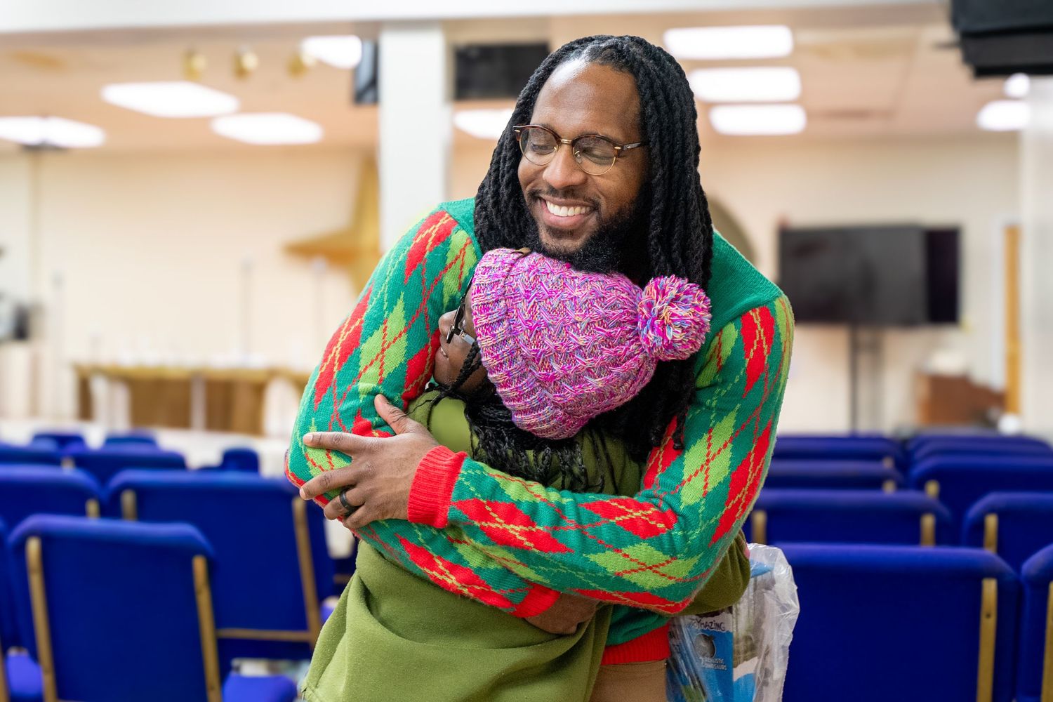 Two people hugging.