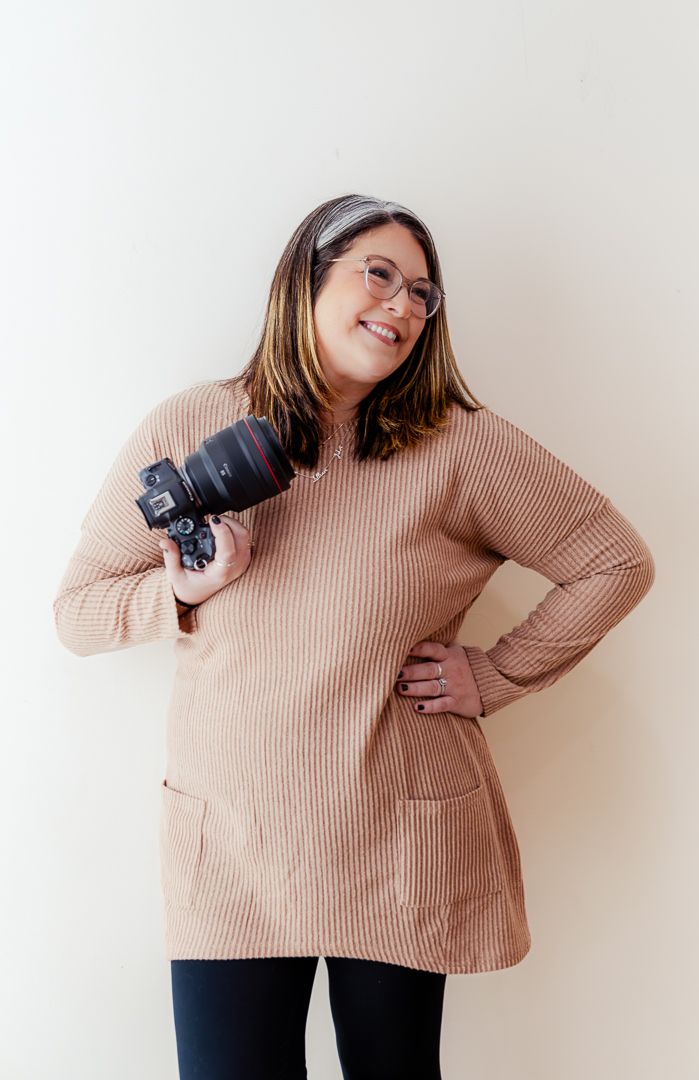 Someone wearing a beige ribbed sweater and dark pants poses playfully in a series of casual lifestyle photos.