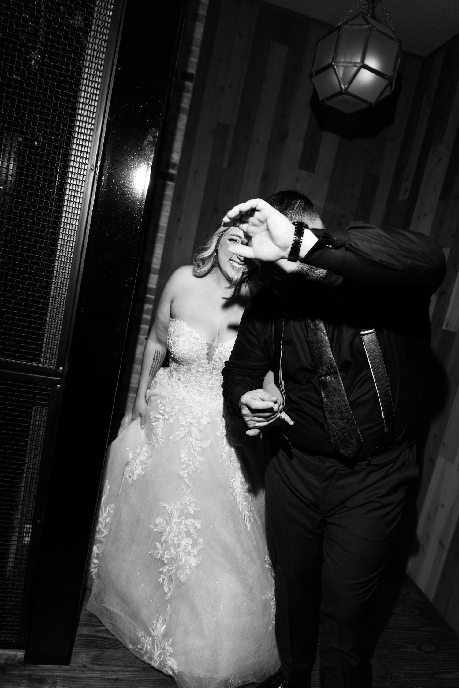 A romantic black and white photo sequence of a couple dancing at their wedding reception.