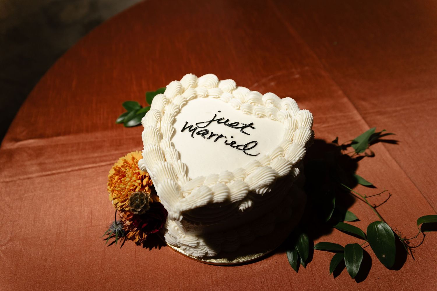 A heart-shaped white cake with 