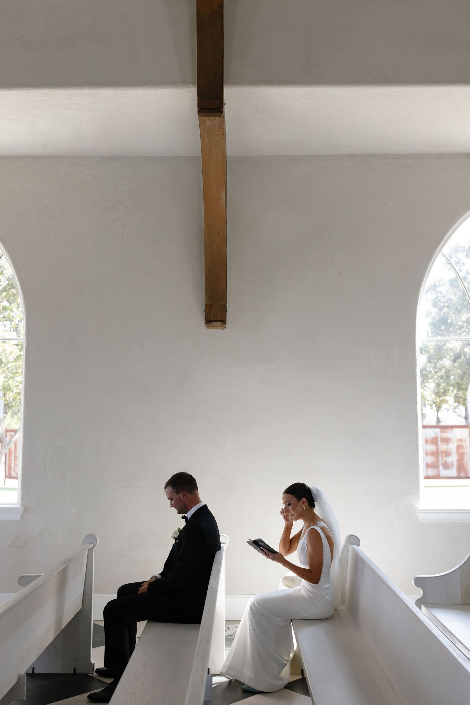 A series of photos showing a couple praying in a white chapel with arched windows.