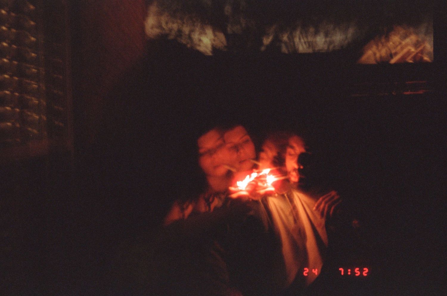 Red glowing effect captured in dark environment with blurred motion streaks creating an abstract light painting.