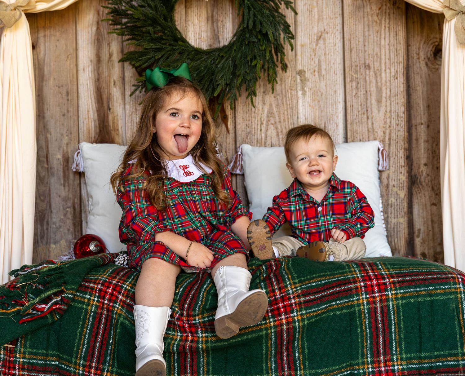 2 children make silly faces for the camera