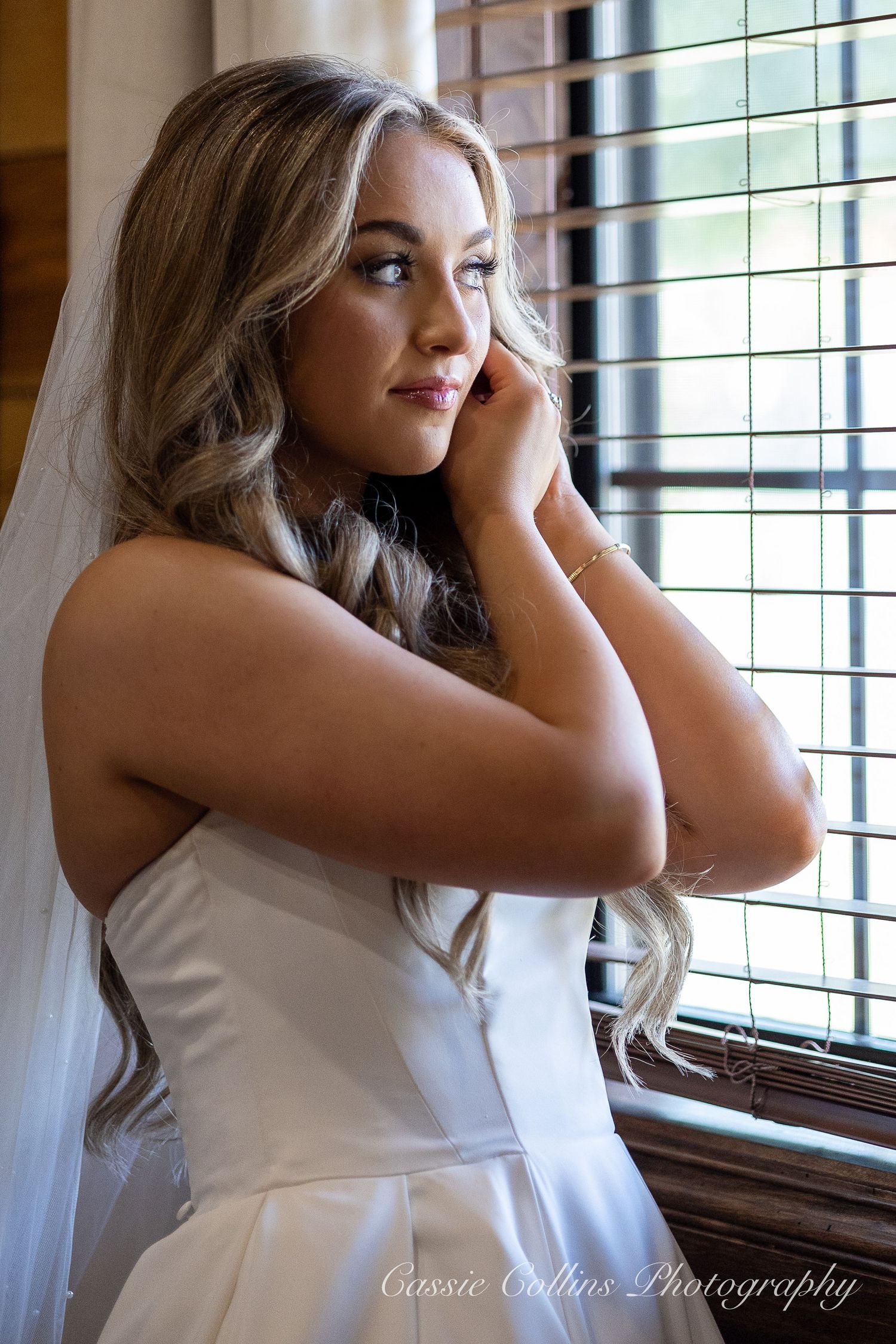 A series of artistic bridal portraits showing a person in a white dress gazing thoughtfully through window blinds.
