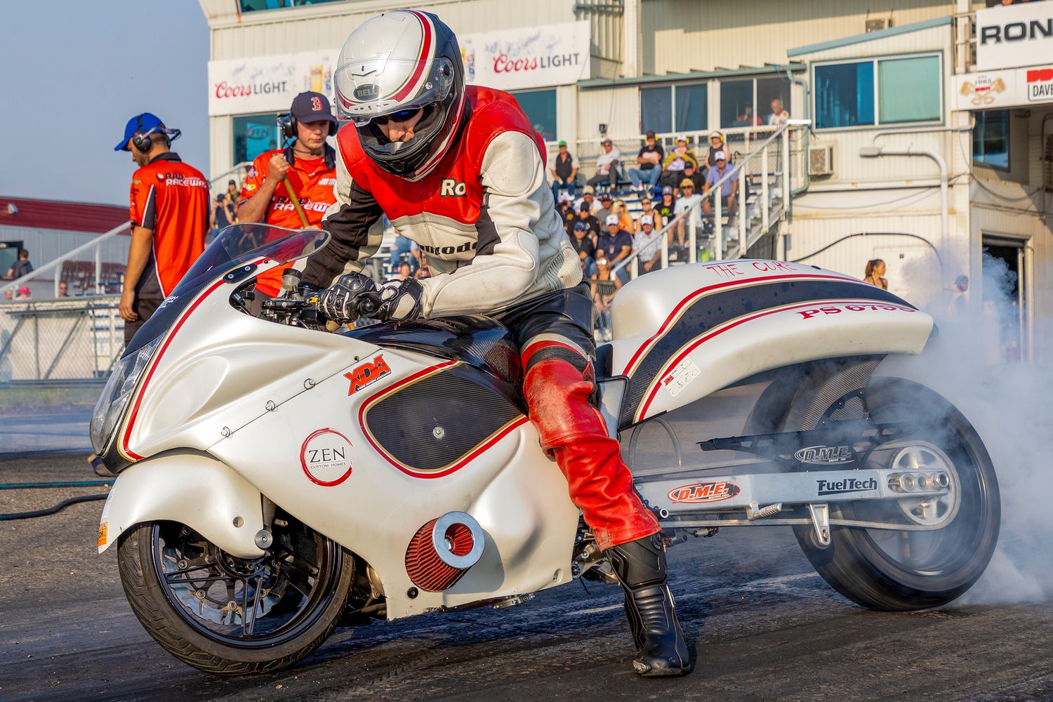 Motorcycle drag racer lights up the tire during a burnout at Hot August Nights, Rad Torque Raceway.