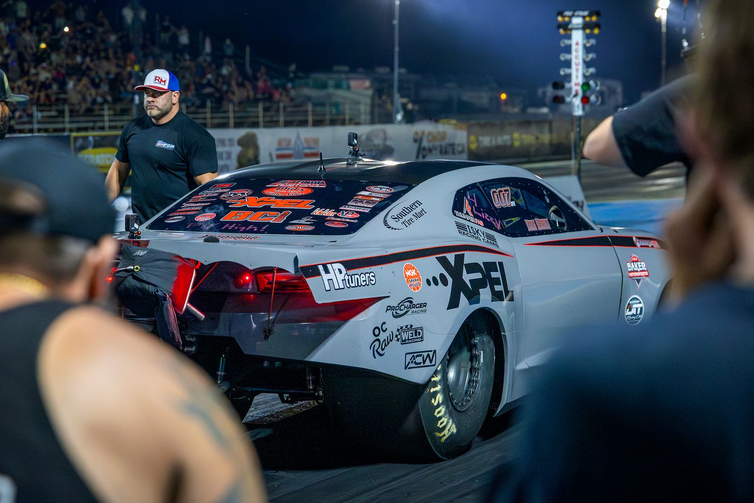 Ryan Martin's Fireball Camaro no prep drag car in the stagging on the drag strip under the lights at Rad Torque Raceway, July 2024