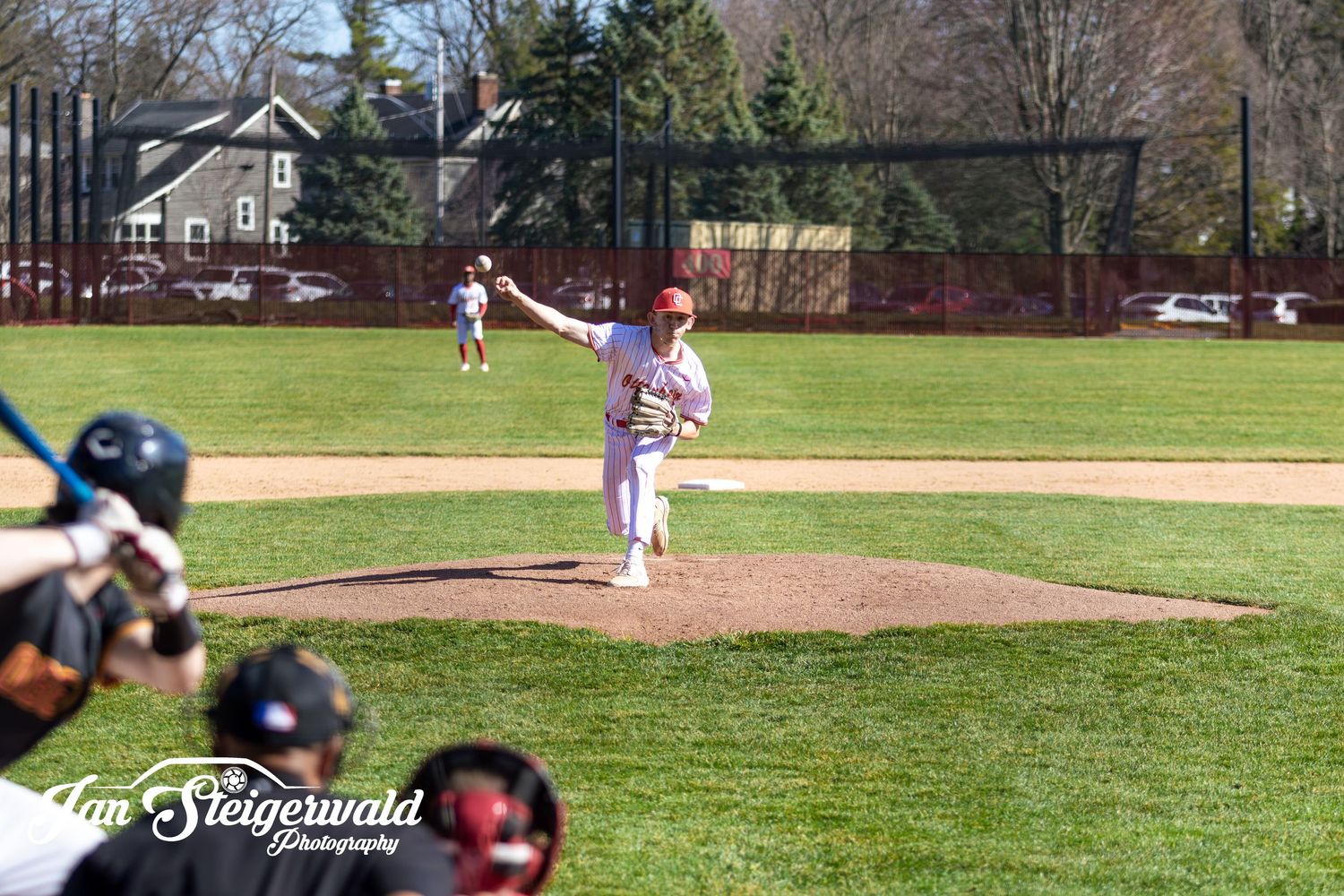 A split image showing multiple baseball players practicing on a sunny grass field with trees in the background.