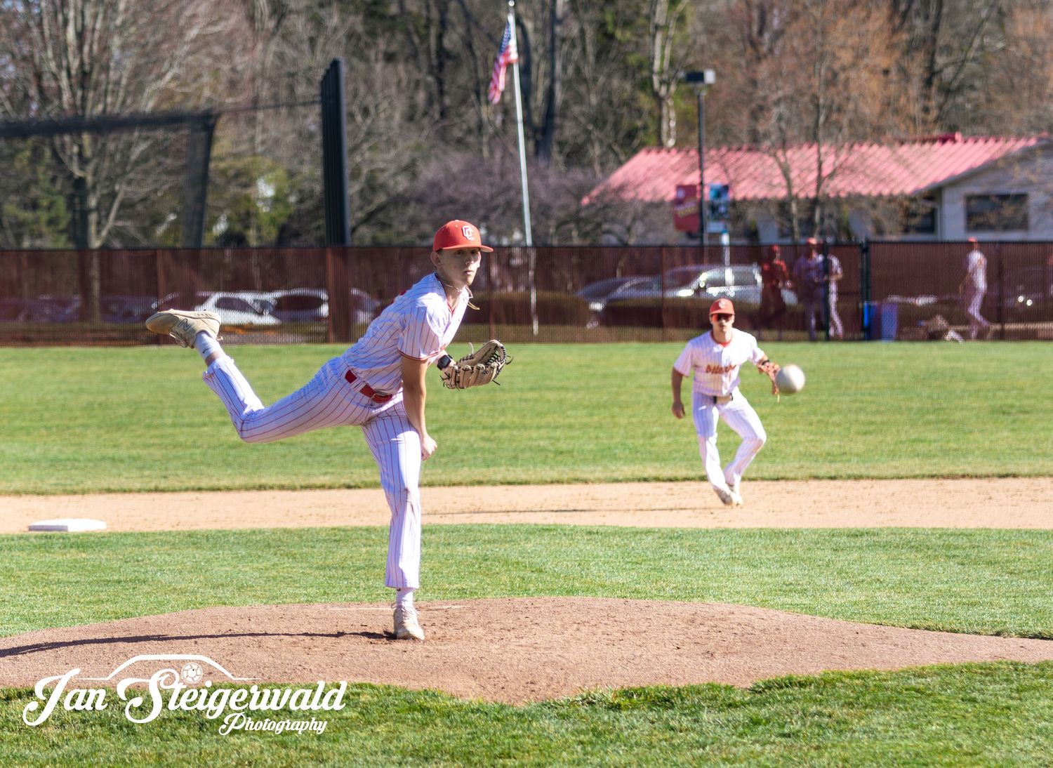 Baseball pitcher in white and red uniform shown in sequential motion frames throwing a pitch from the mound during game.