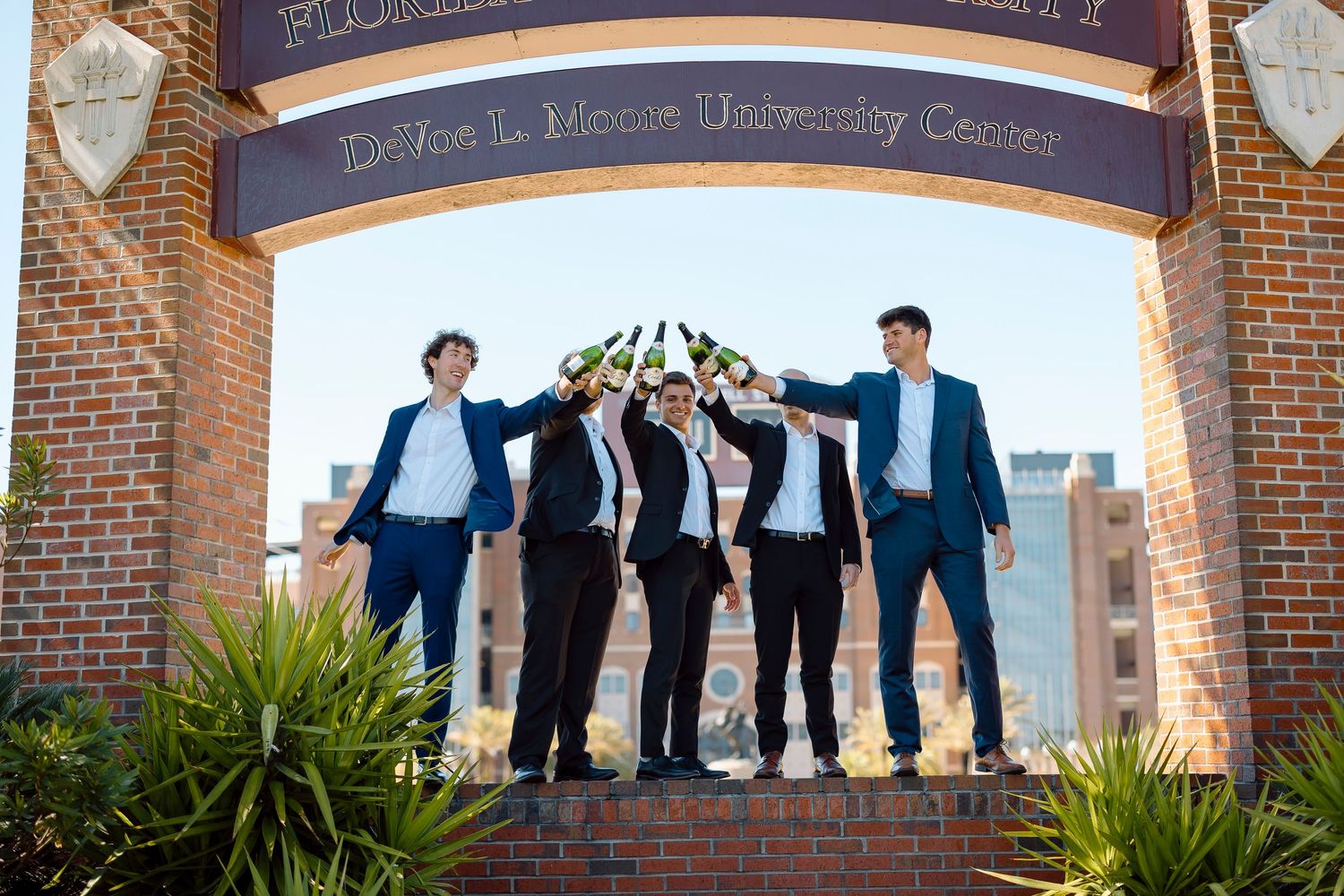 Group photo under DeVoe L. Moore University Center sign.