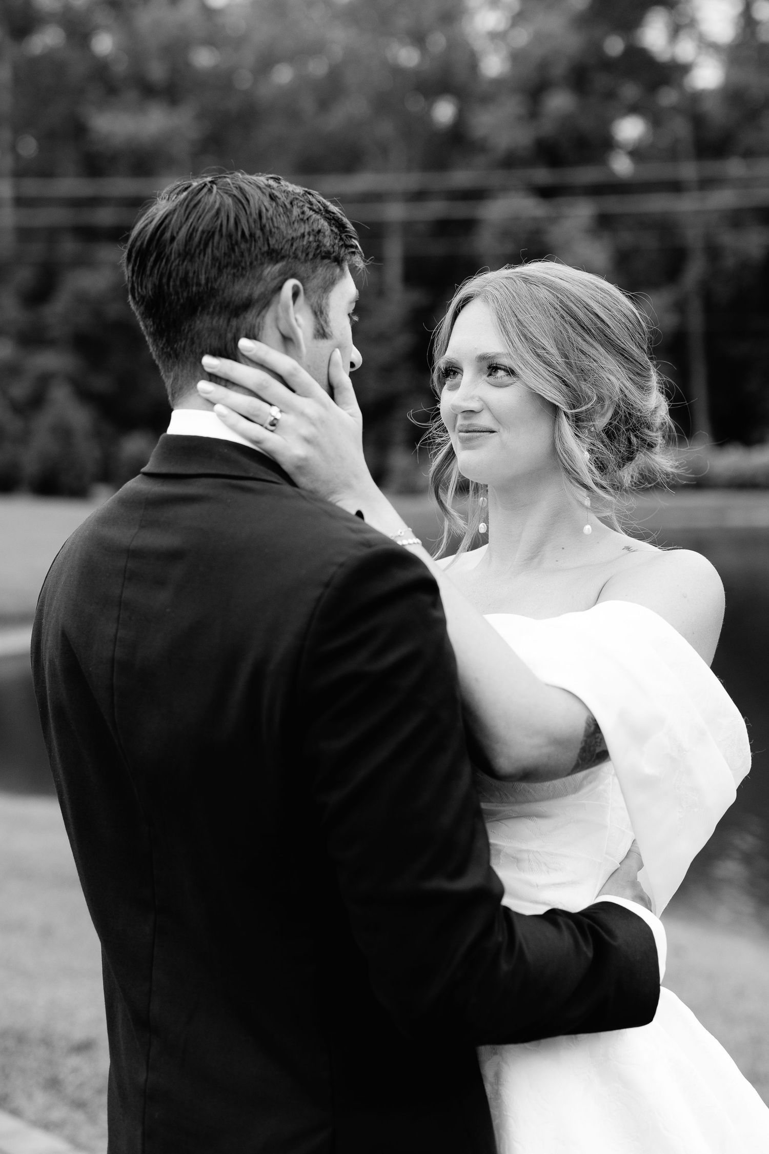 Black and white sequence of bride and groom sharing an intimate dance moment at their wedding celebration.