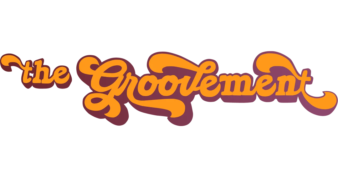 A colorful retro-style logo design featuring the text 'The Enablement' in orange and brown tones.