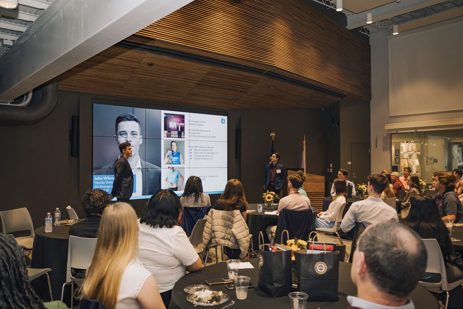 Business professionals gathered in a modern conference room for a corporate training session.