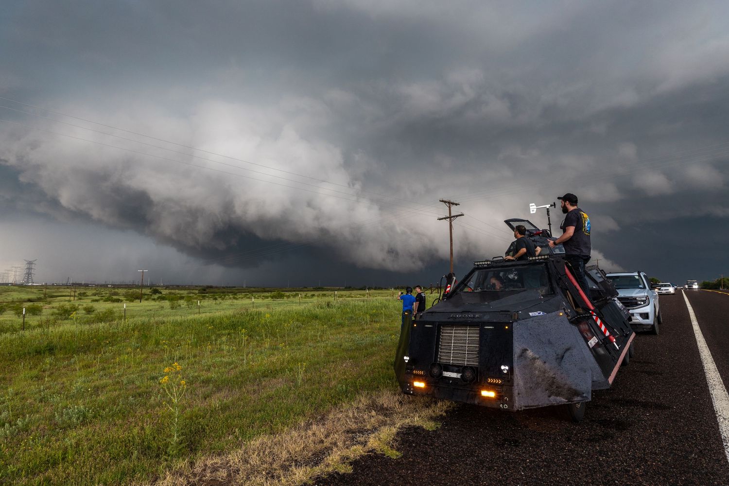 Storm chasers and meteorologists monitor approaching tornado warned storm from the TIV-2 tornado intercept vehicle.