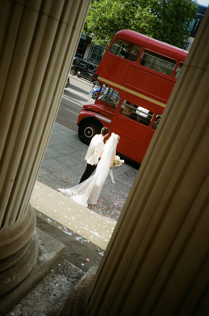 Couple gazing at a classic London double-decker