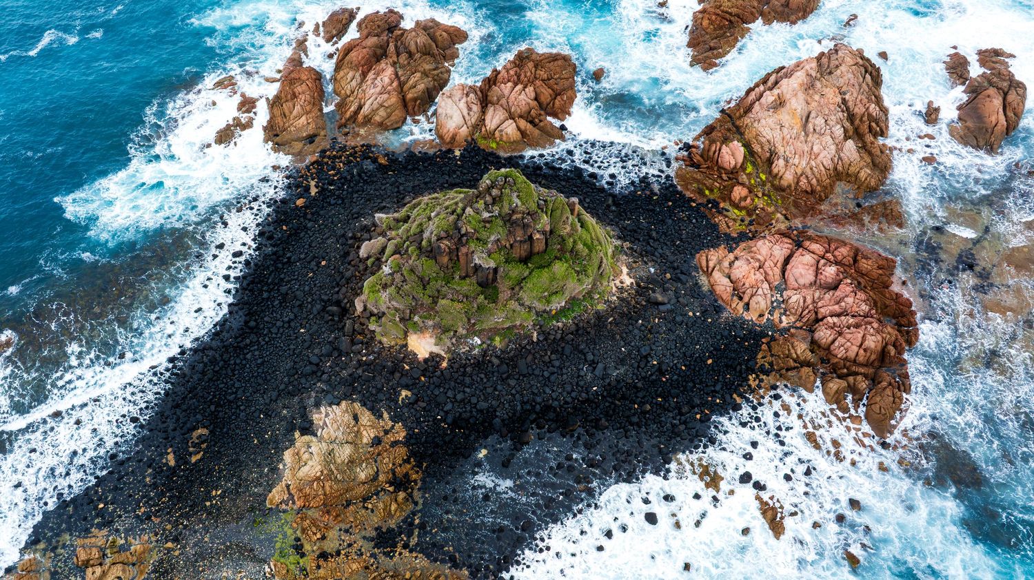 Aerial view of Pyramid rock and surf off Phillip Island