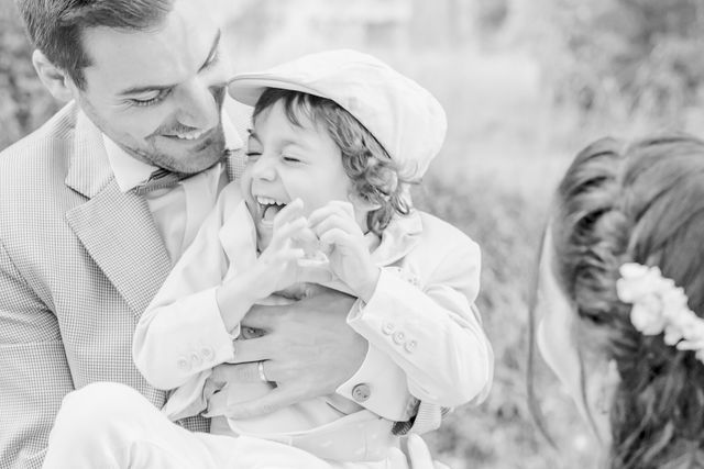 Black and white intimate family portrait in natural light.