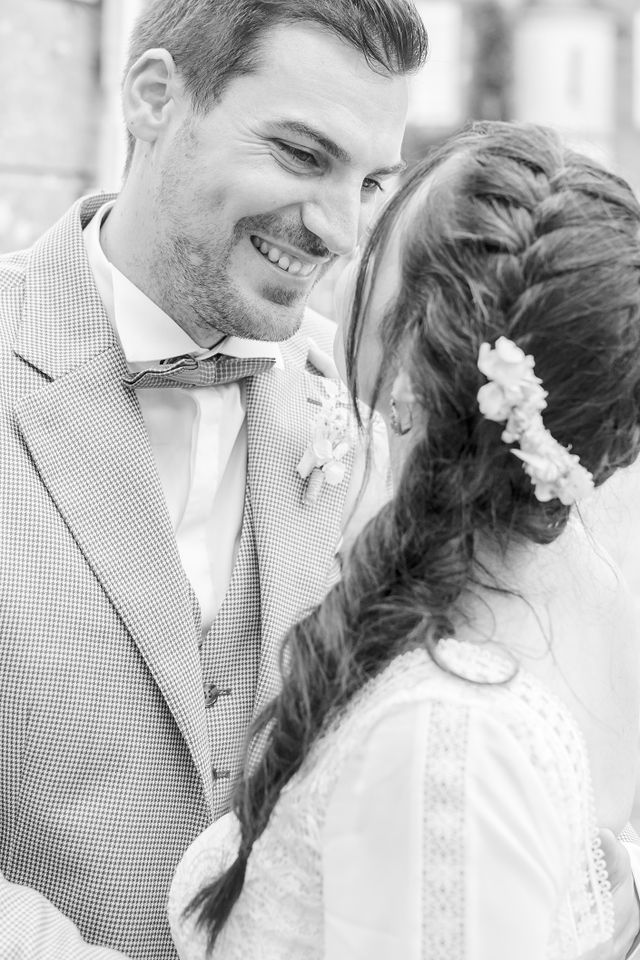 Romantic wedding portraits captured in soft, ethereal light against classic architecture.