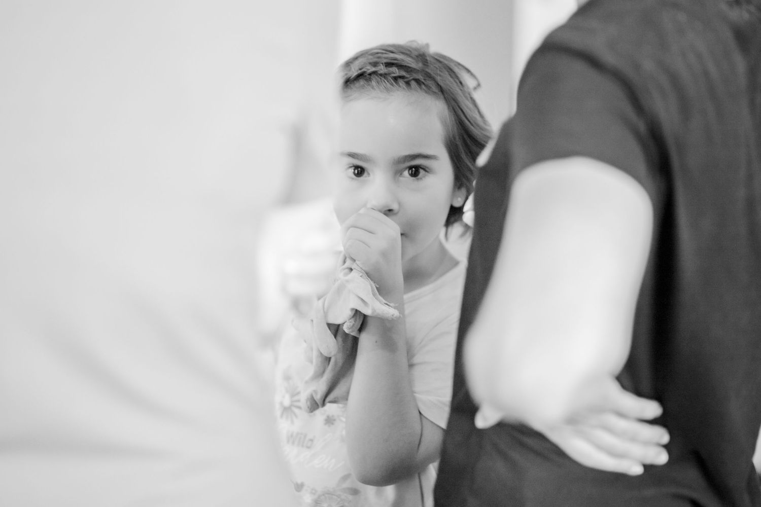 Black and white portrait in indoor setting.