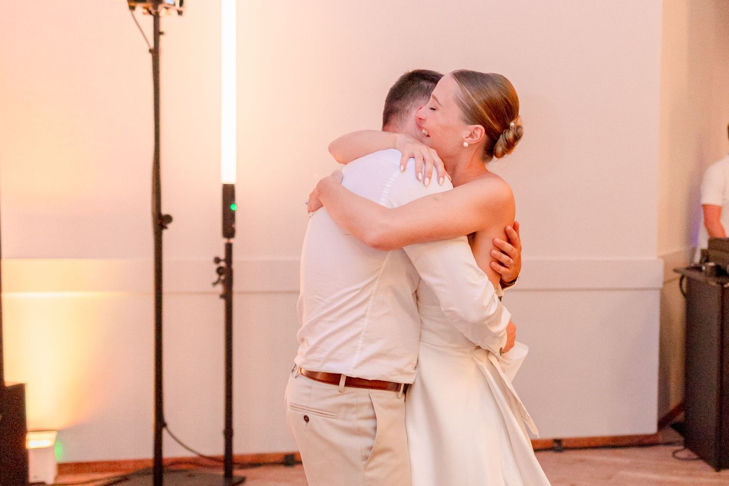 Couples sharing intimate dance moments during wedding reception.