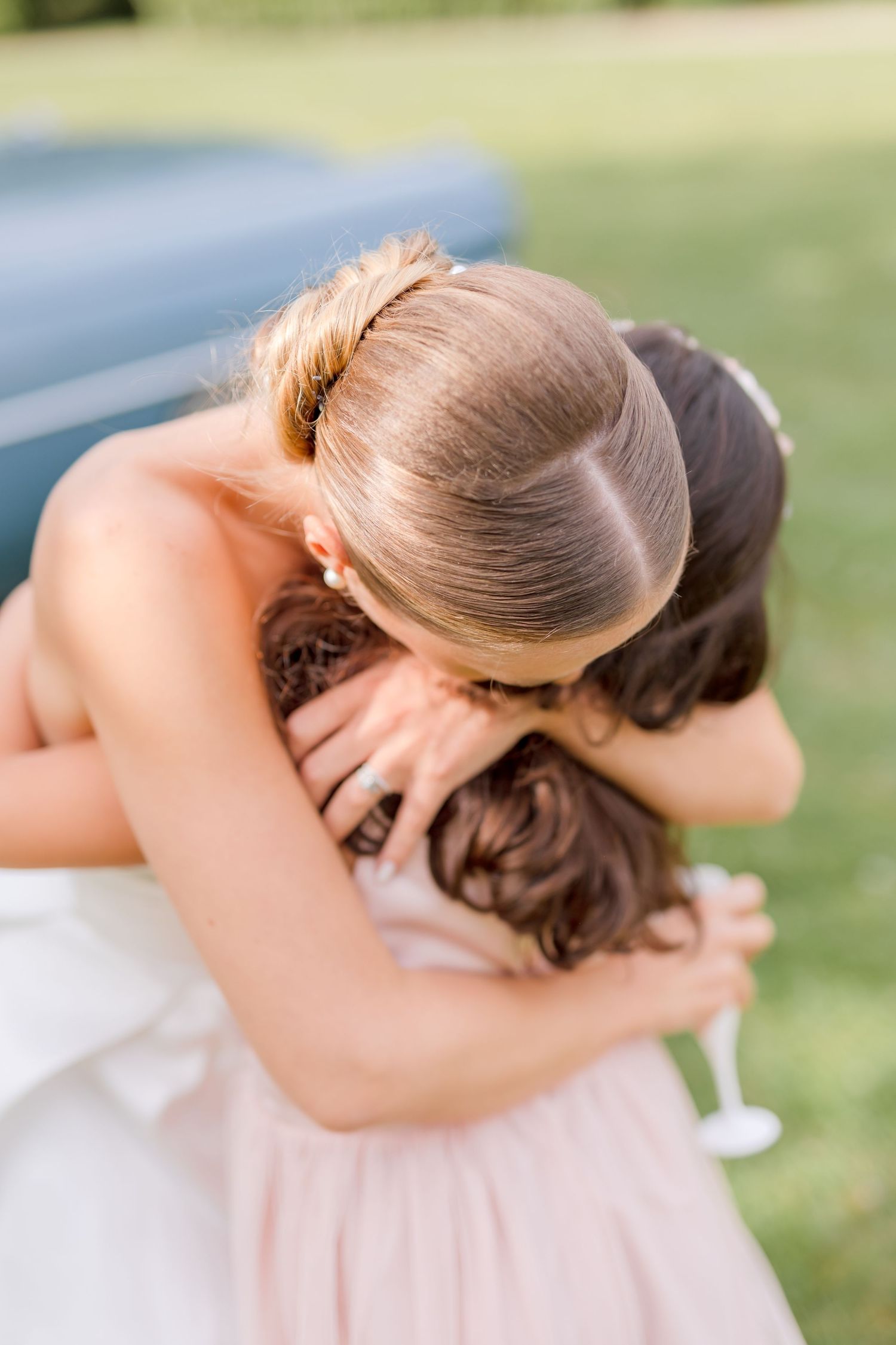Close-up shots show elegant bridal hairstyle details with intricate updo and twisted bun styling.