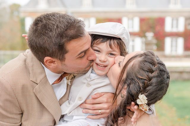 Tender family moment captured in soft autumn lighting.