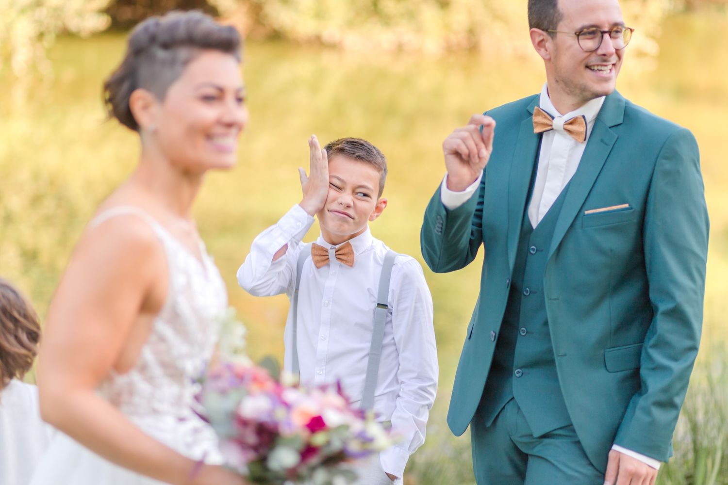 Joyful outdoor wedding moment with expressions of happiness.