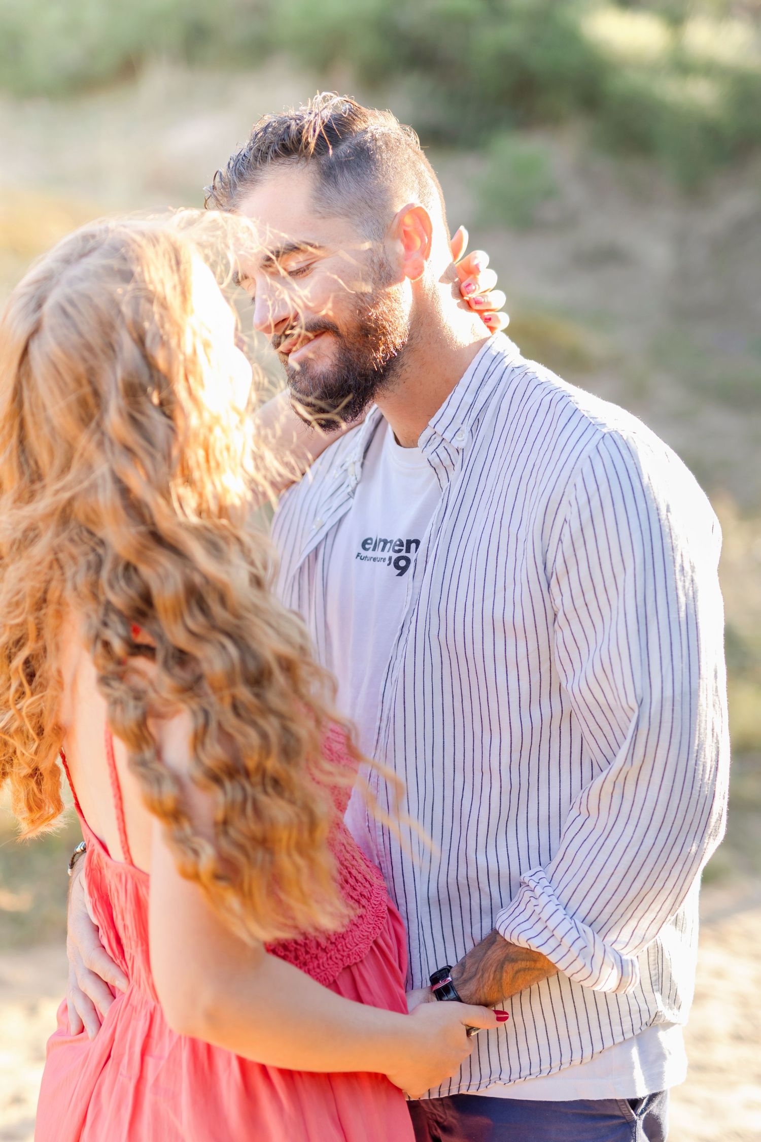 Tender outdoor portrait of couple during golden hour photo session.