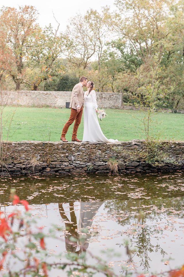 Wedding photography sequence showing couple by stone wall with autumn reflections.