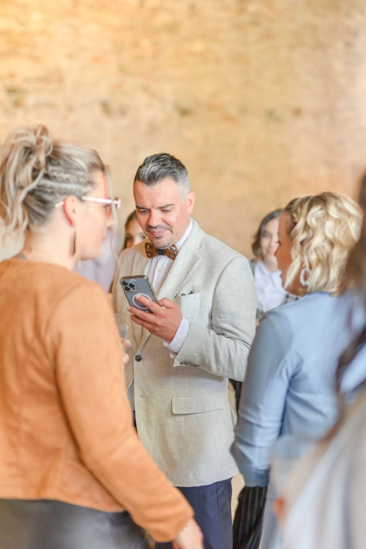 Wedding guests socializing during an outdoor reception.