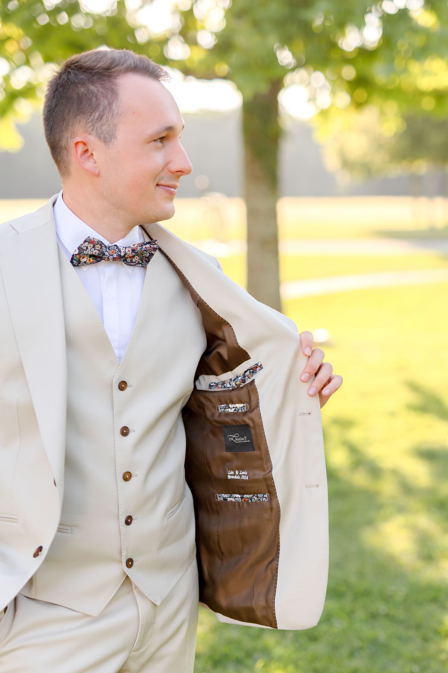 Detail shots of cream colored wedding suit with brown lining.