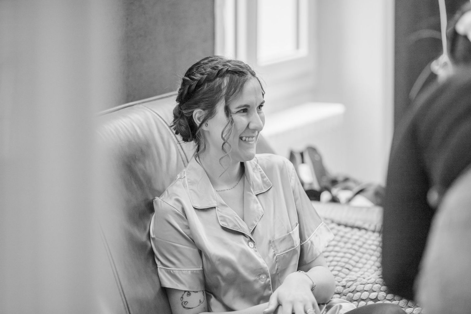 Black and white photo series showing wedding day preparation and makeup application.