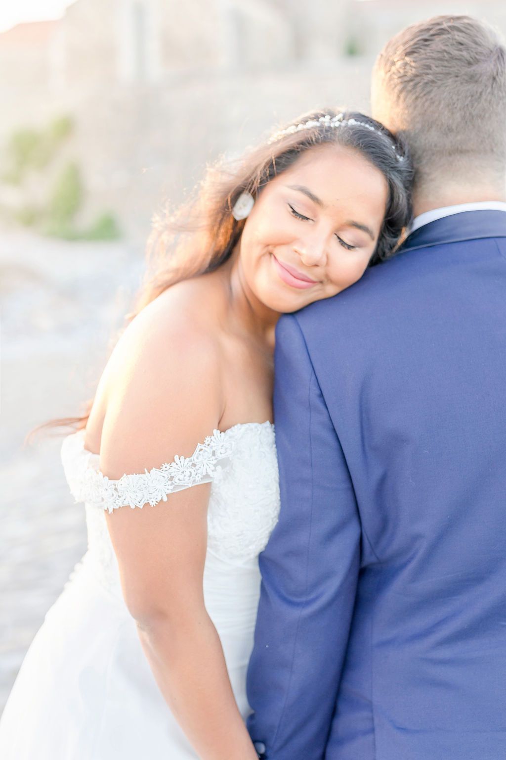 Romantic wedding portrait with soft lighting and intimate couple poses.
